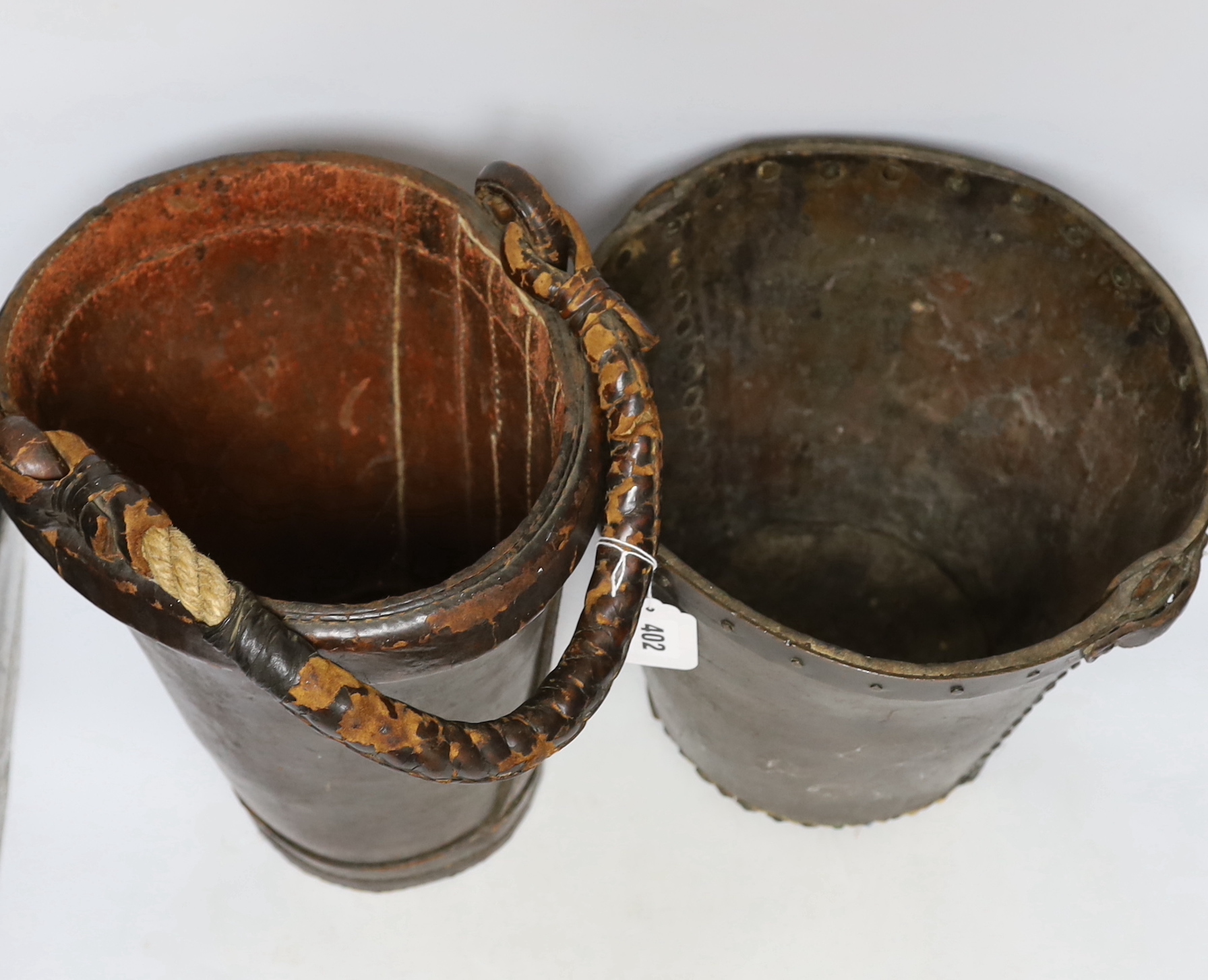 Two 19th century leather fire buckets, tallest 32.5cm